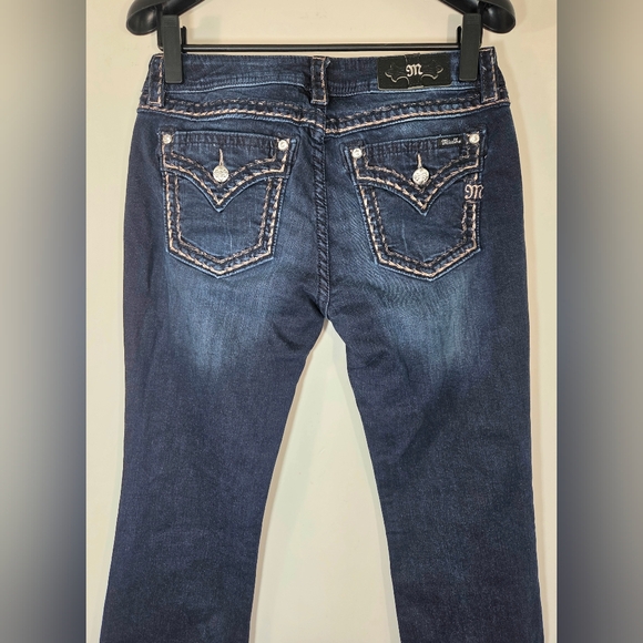 NEW MISS ME MID-RISE BOOTCUT JEANS. - Picture 4 of 8